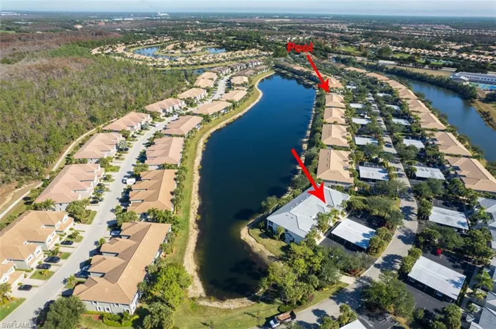 Aerial overview of property's location with a large body of water and nearby suburban area