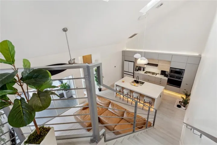 Stairway with light tile flooring