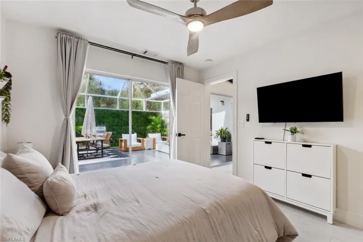 Bedroom featuring ceiling fan and light tile flooring