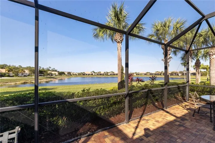 Unfurnished sunroom featuring a water view