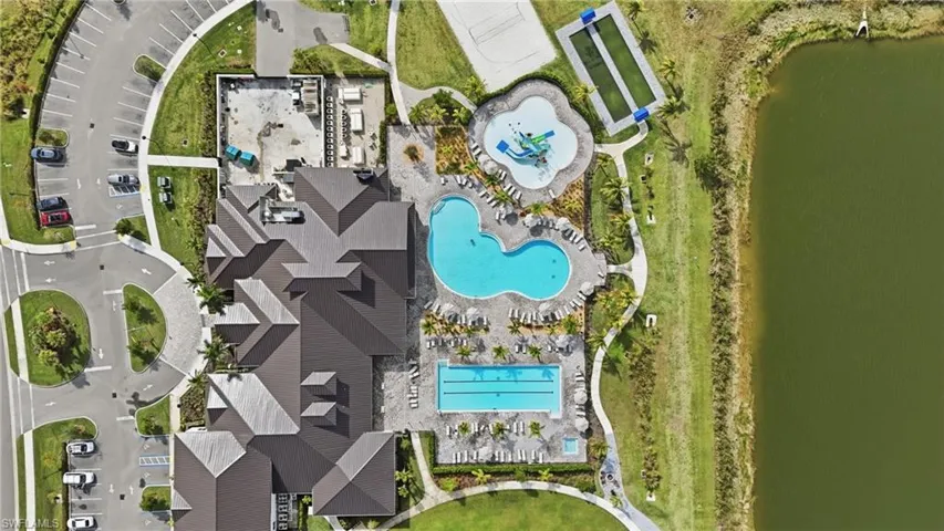 Bird's eye view of a pool area and a large body of water