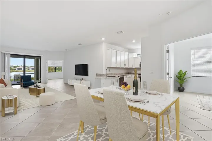 Dining area with light tile patterned flooring and recessed lighting