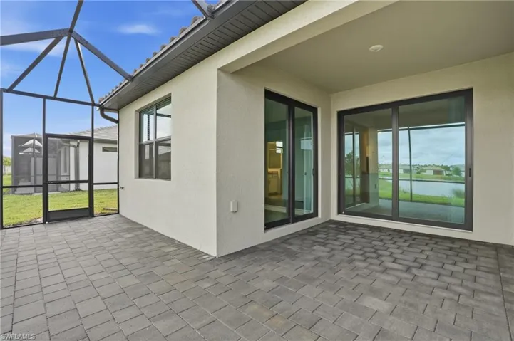 Unfurnished sunroom with a patio