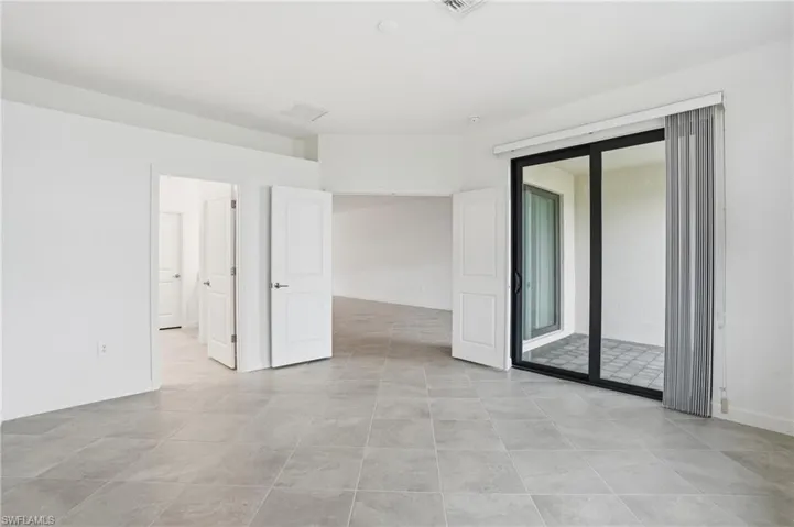 Unfurnished room featuring baseboards