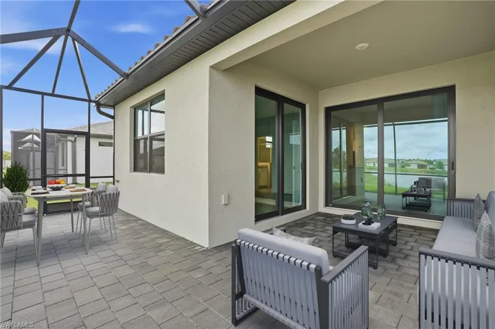 View of patio / terrace featuring outdoor lounge area and glass enclosure