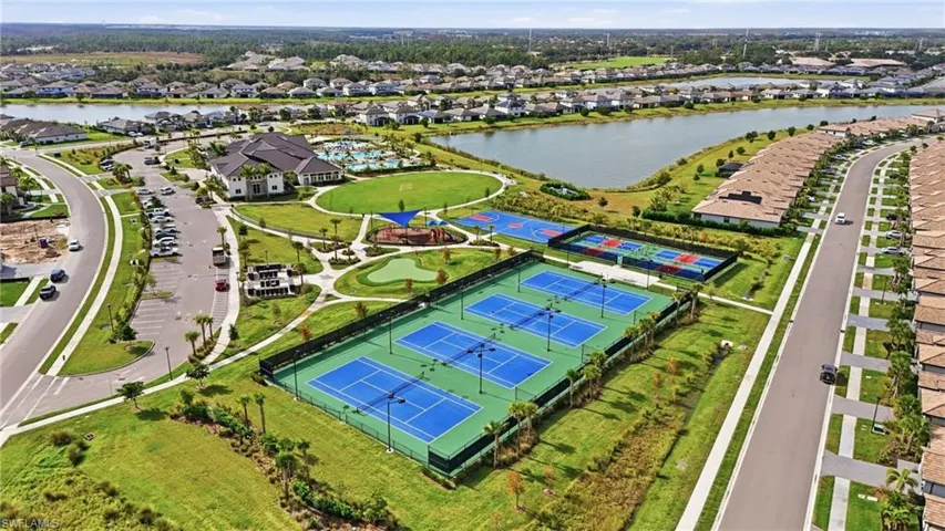 Aerial perspective of suburban area with a nearby body of water