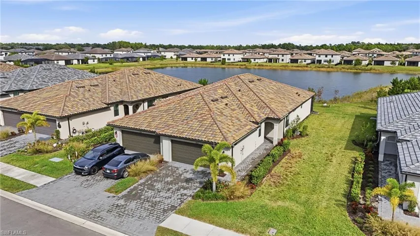 Aerial perspective of suburban area with a large body of water