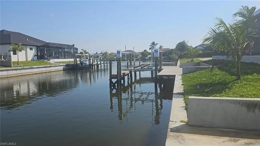 Dock area featuring a water view and boat lift