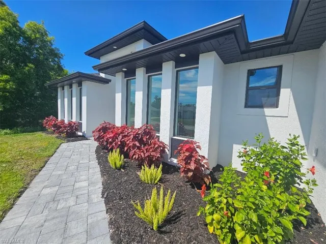 View of property exterior with stucco siding