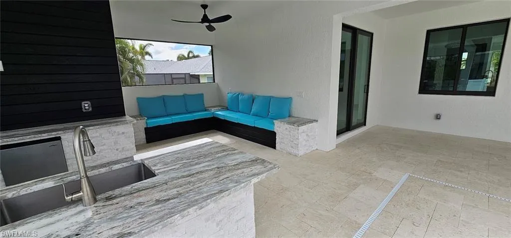 View of patio / terrace featuring a ceiling fan and outdoor lounge area