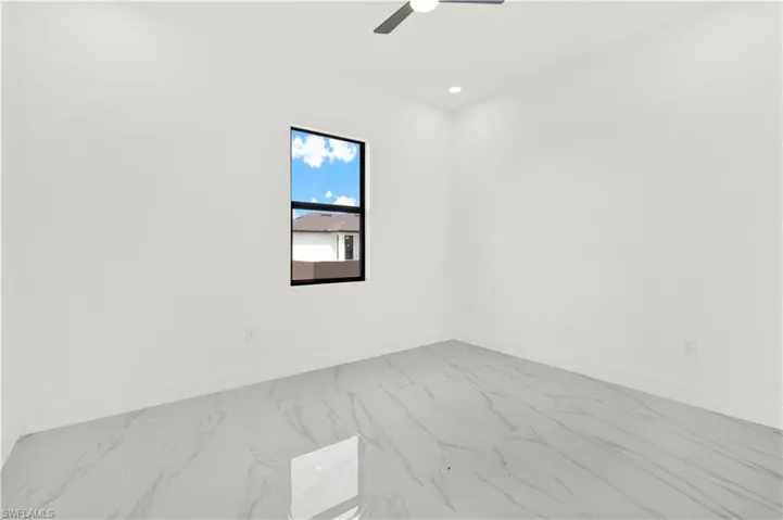 Spare room with light marble finish flooring, recessed lighting, and a ceiling fan