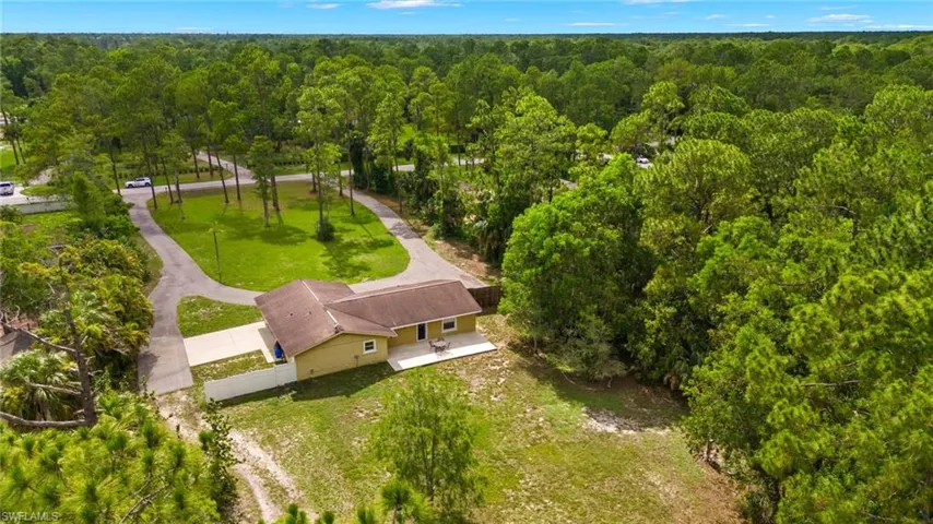 View from above of property with a heavily wooded area