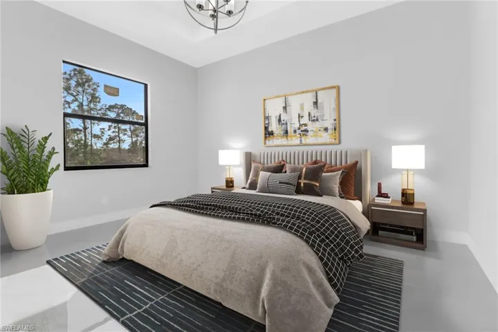Bedroom with concrete flooring and a notable chandelier