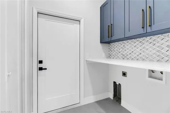 Laundry area with cabinets and electric dryer hookup