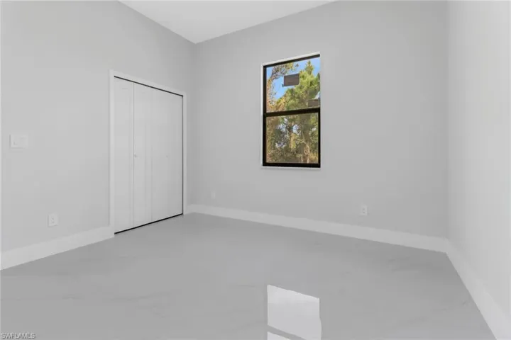 Unfurnished bedroom with a closet