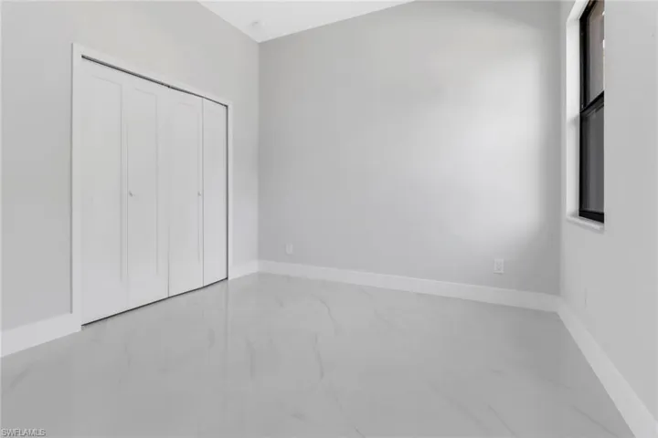 Unfurnished bedroom with a closet