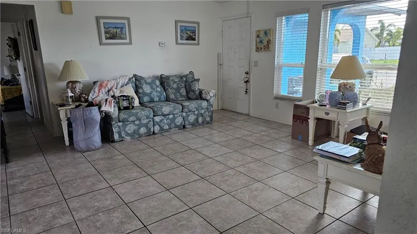 Living area featuring light tile patterned floors