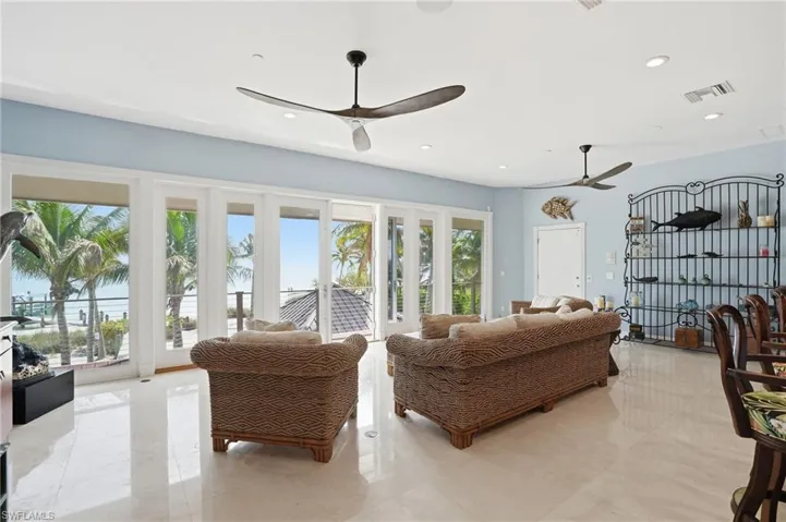 Living area featuring ceiling fan and recessed lighting