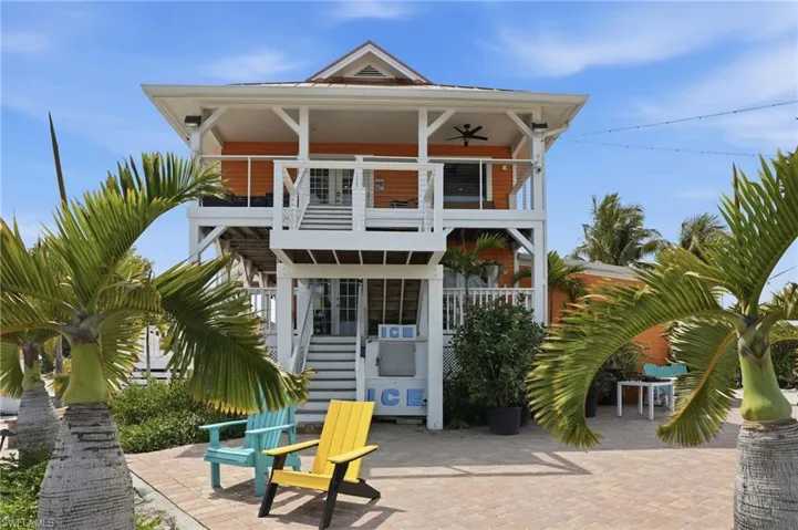 Back of house featuring a balcony and a patio area