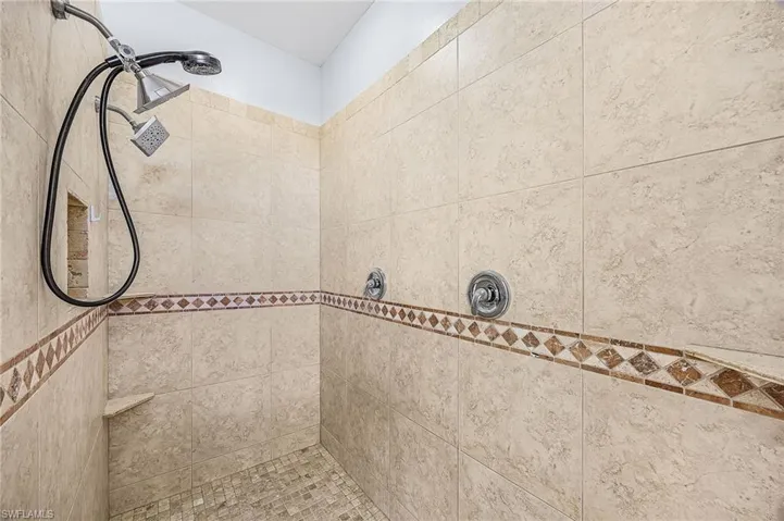 Bathroom featuring a tile shower