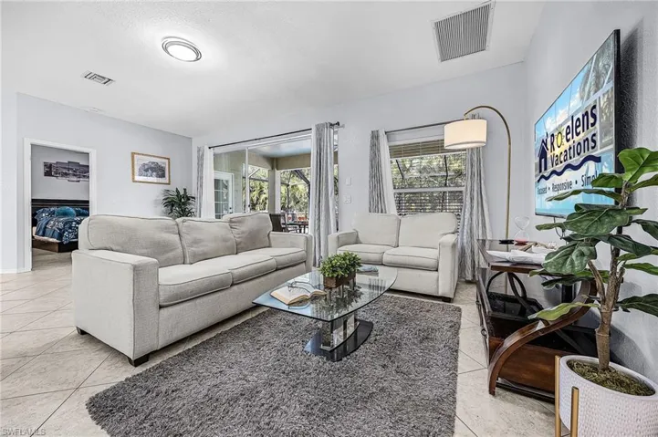Living area with light tile patterned flooring