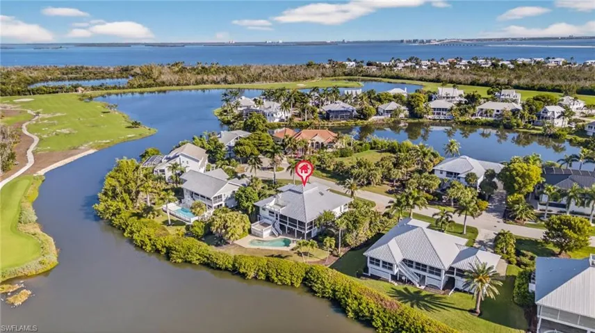 Aerial view of residential area with a nearby body of water
