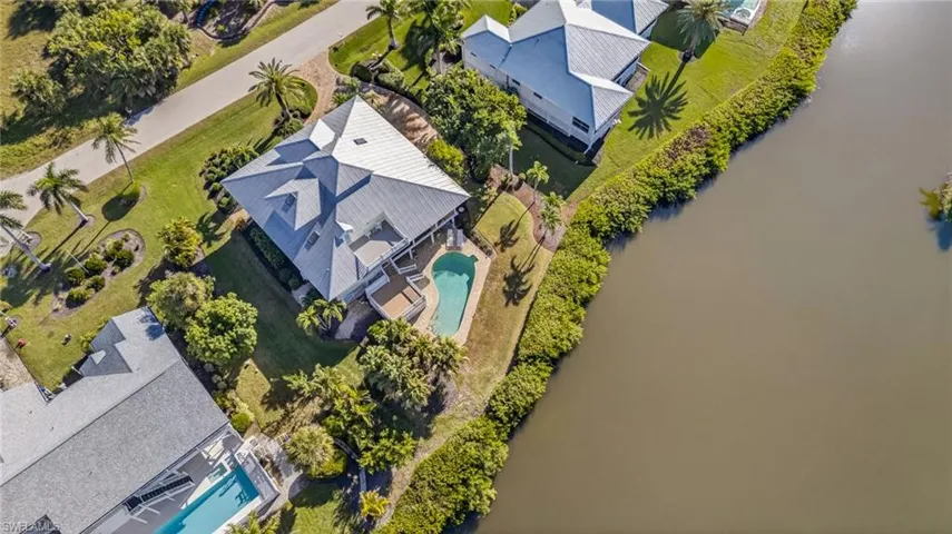 Bird's eye view of a pool and a large body of water