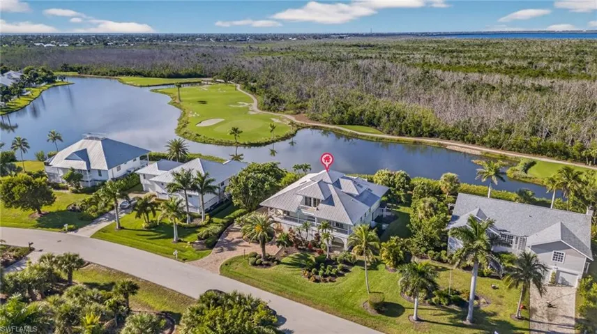 Bird's eye view of a large body of water and a local golf course
