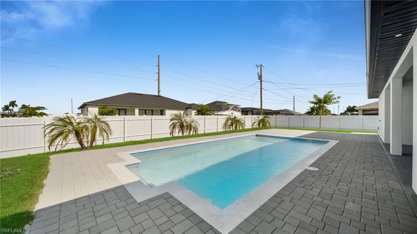 View of pool featuring a patio and a fenced backyard
