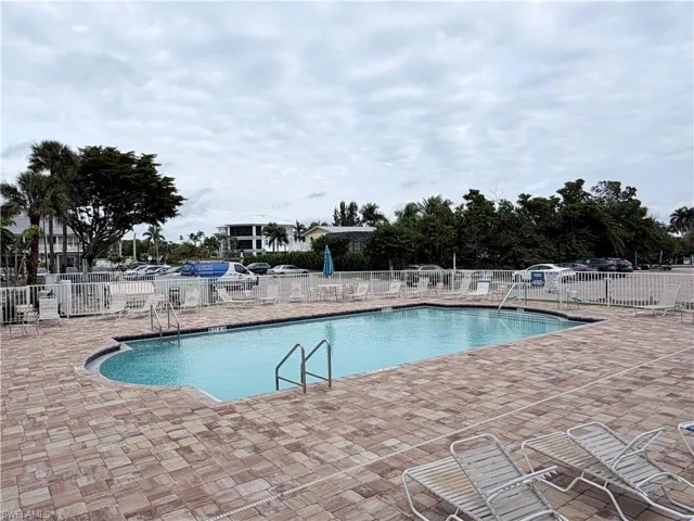 Community pool featuring a patio area