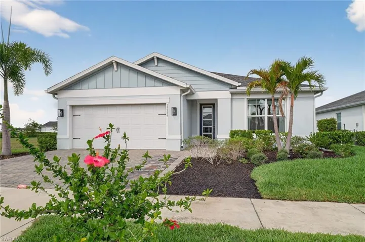 Ranch-style house with decorative driveway and a 2-car garage.