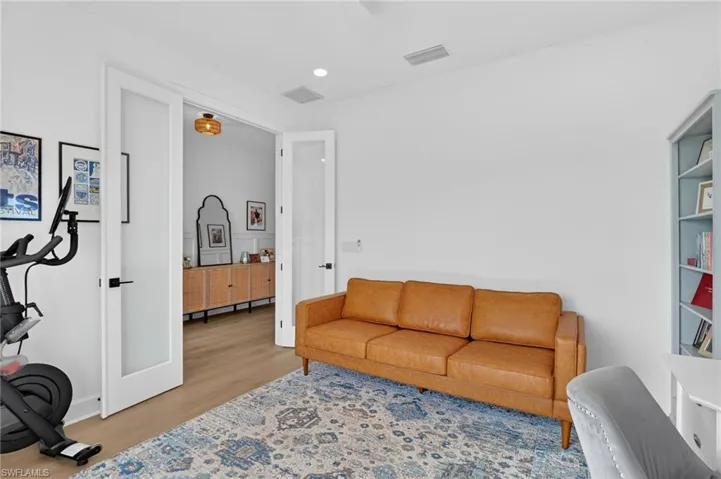 Den with class French doors recessed lighting