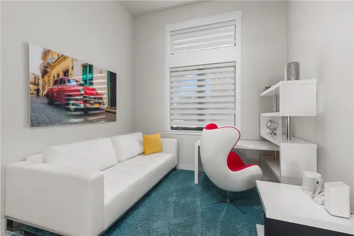 Carpeted office featuring healthy amount of natural light and baseboards