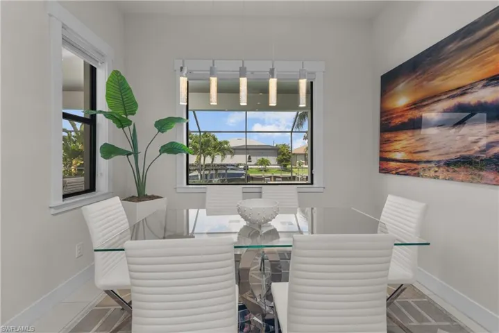 Tiled dining room with baseboards