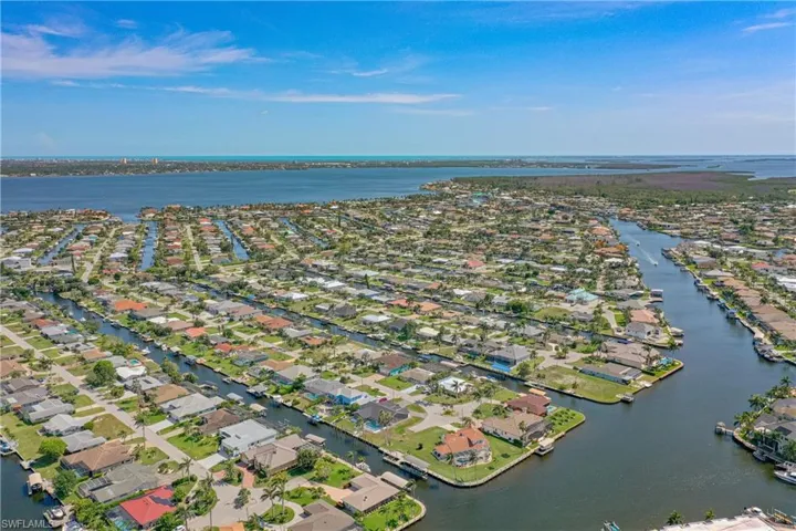 View of property location featuring nearby suburban area and a large body of water