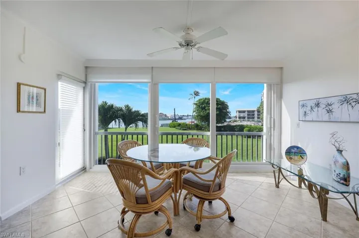Florida Room overlooking Bay waters and landscape area