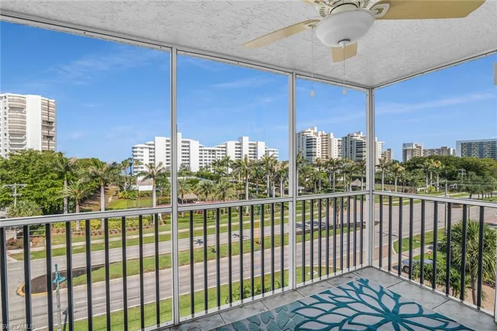 Unfurnished sunroom featuring a view of city