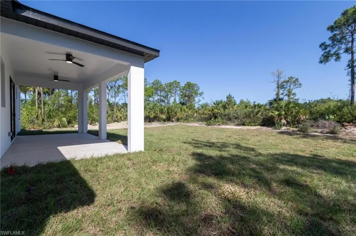 View of yard featuring ceiling fan