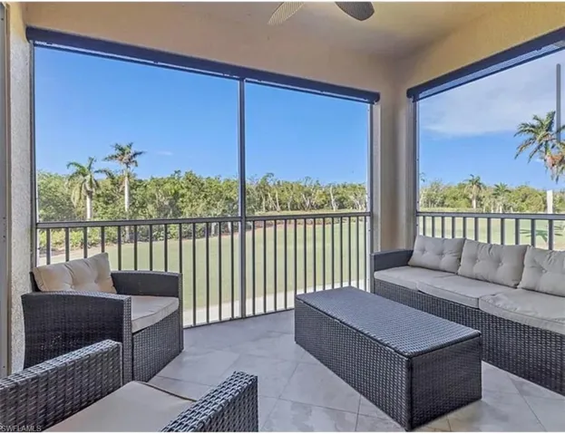 Sunroom / solarium with an outdoor hangout area and a ceiling fan