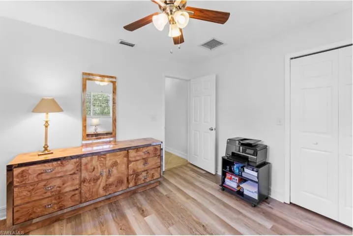 Office featuring light wood-type flooring and ceiling fan