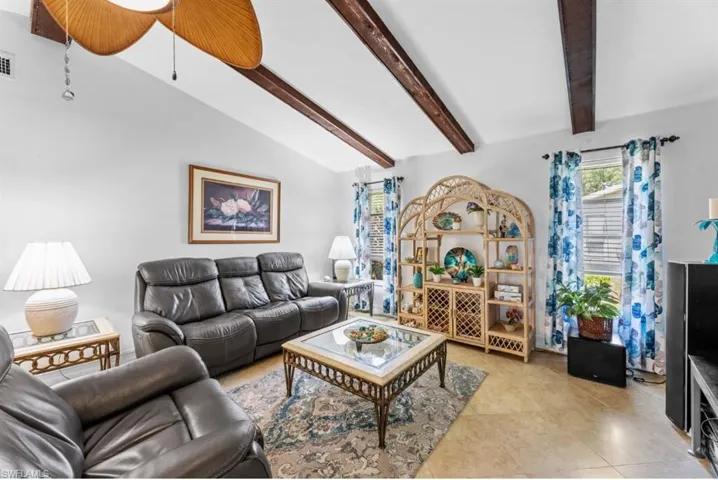 Living room with light tile patterned floors