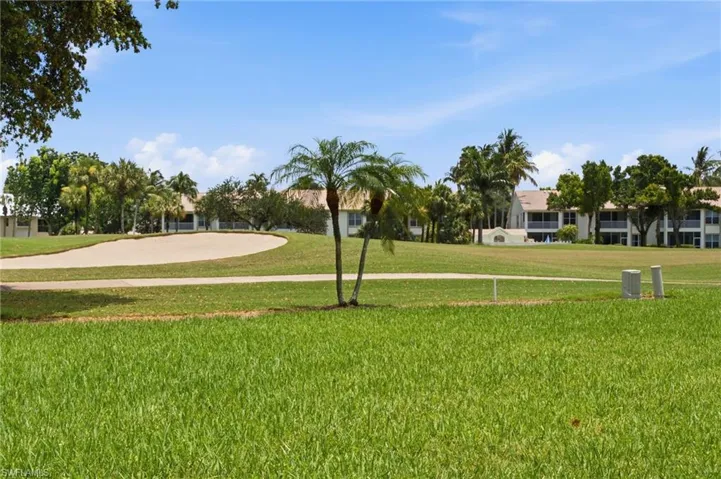 A serene golf course panorama awaits from your private lanai, offering a tranquil outdoor retreat where you can relax, unwind, and enjoy the beauty of the surrounding landscape.