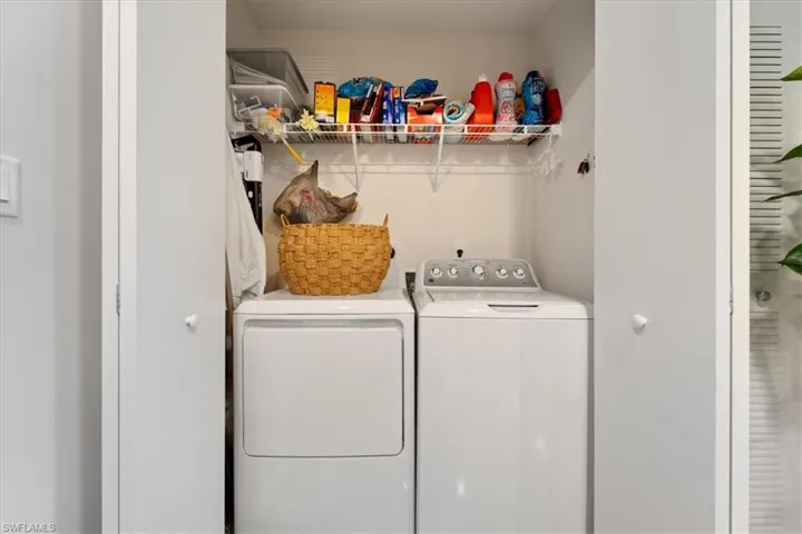 Laundry area featuring laundry area and washer and clothes dryer