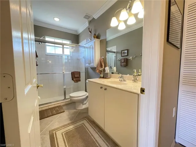 Full bath featuring vanity and a stall shower