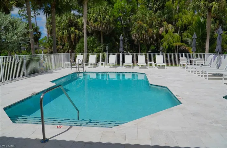 Community pool featuring a patio area