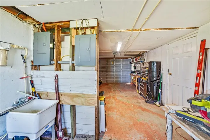 Basement featuring sink and electric panel