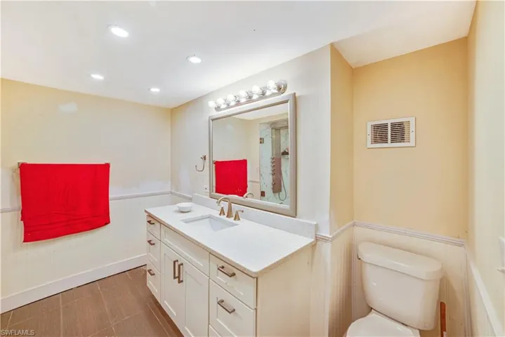 Bathroom featuring vanity and toilet