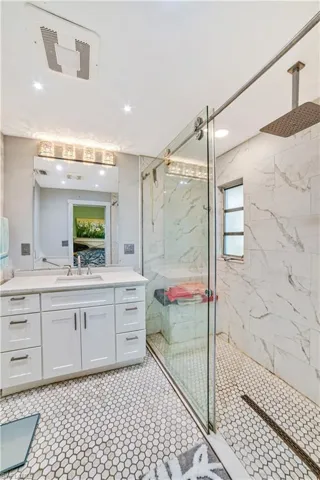 Bathroom with vanity and an enclosed shower