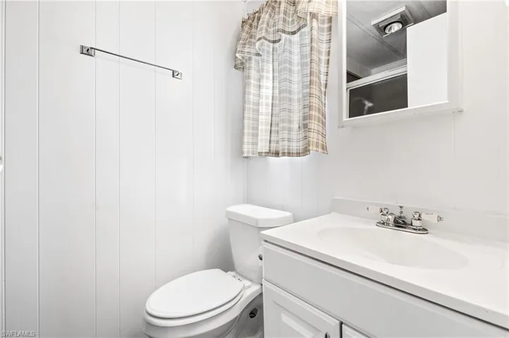 Bathroom with vanity and a shower