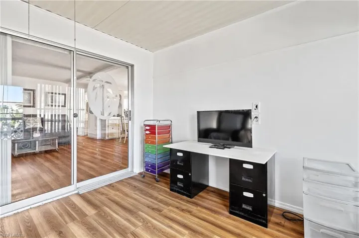 Office featuring wood finished floors and baseboards
